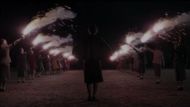 Girls stand in a queue with flares in their hands during the final moments of Six Minutes to Midnight. (Image via Lionsgate)